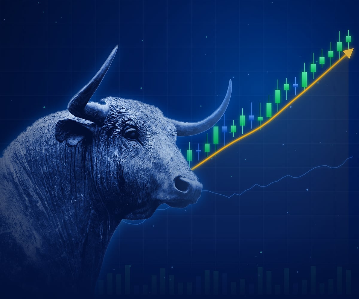 Bronze bull in cool blue light in front of a rising candlestick chart with a gold upward trend line